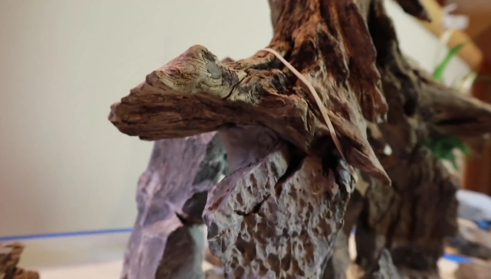 Using epoxy putty to improve the stability of the rocks.