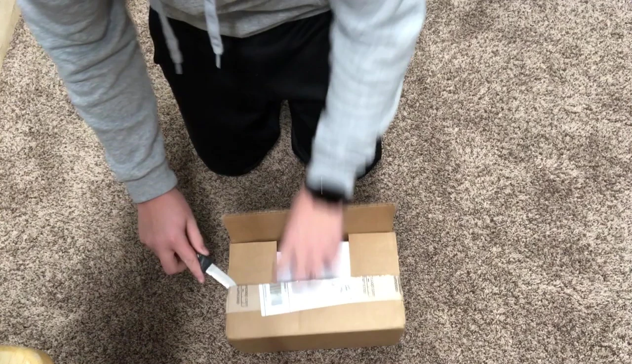 Unboxing the Aquarium Co-Op sponge filter package, revealing the inner boxes.