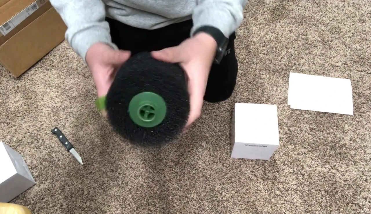 Assembling the filter: attaching the intake tube and sponge.