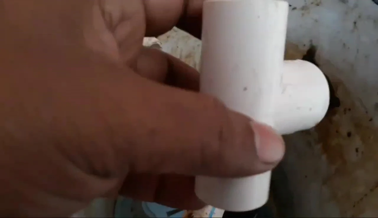 The elbow joint in its new position to prevent backflow.