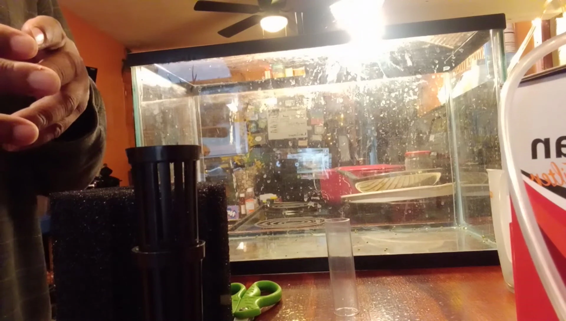 Demonstrating how to fill the filter with additional media.