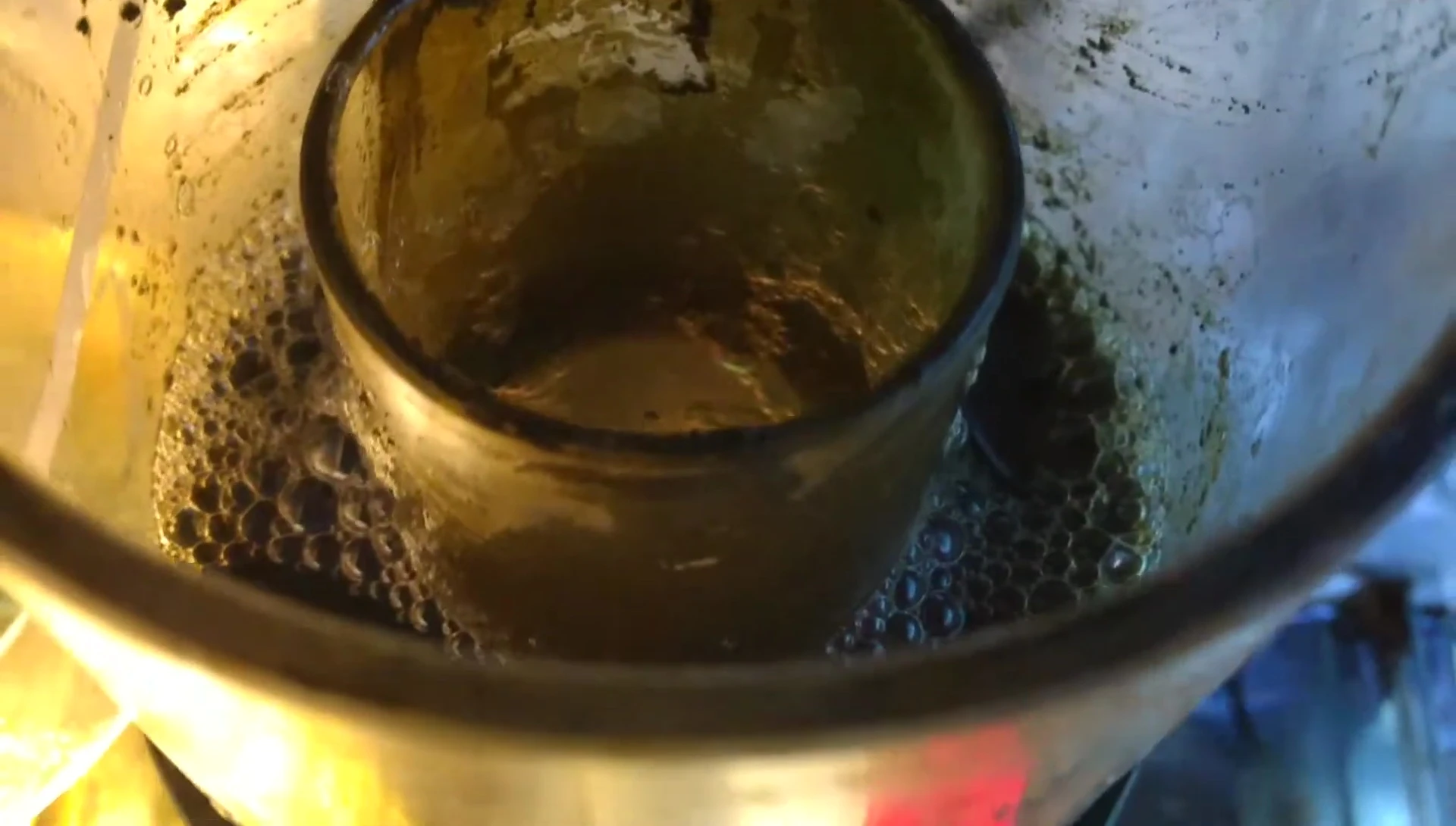 Close-up shot highlighting the compact size and dark color of the skimmer.