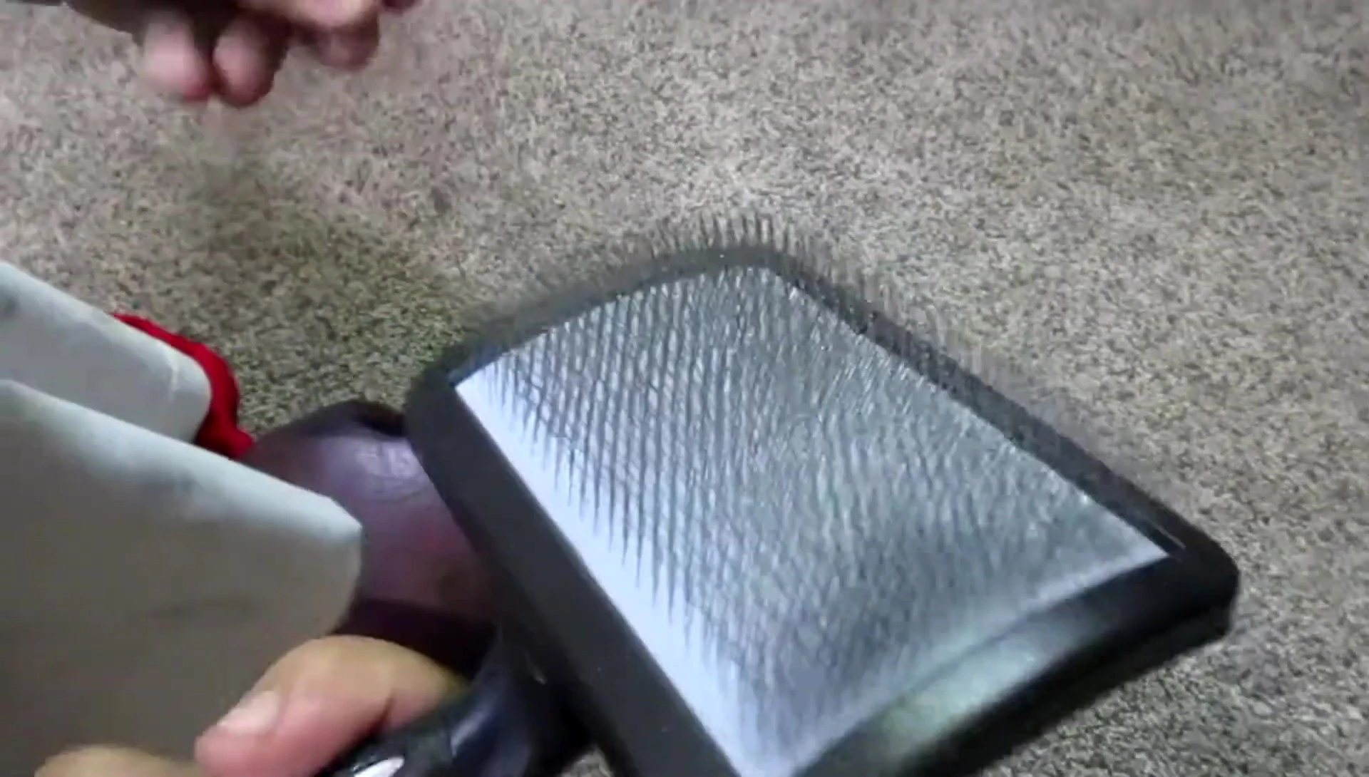 The reviewer demonstrating the ease of cleaning the brushes.
