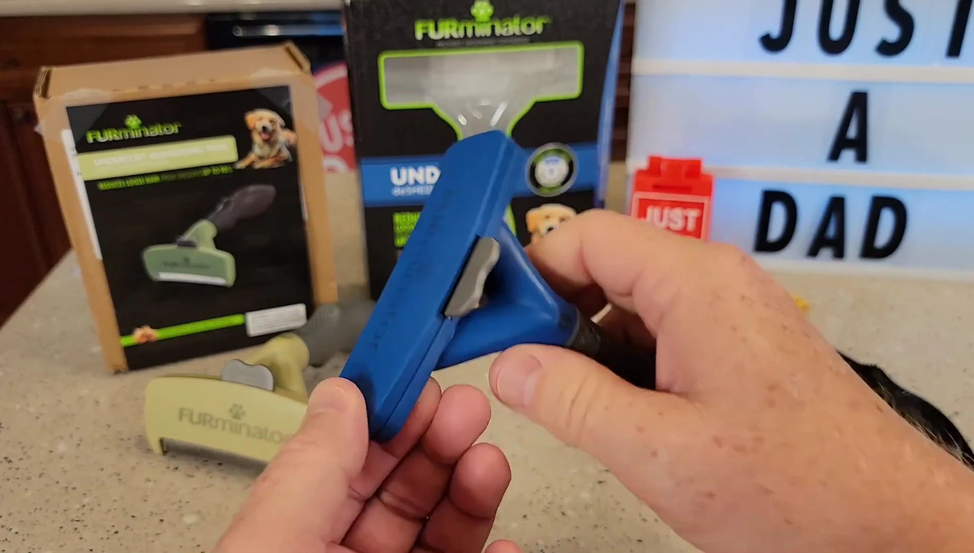 Close-up of the green FURminator de-shedding tool