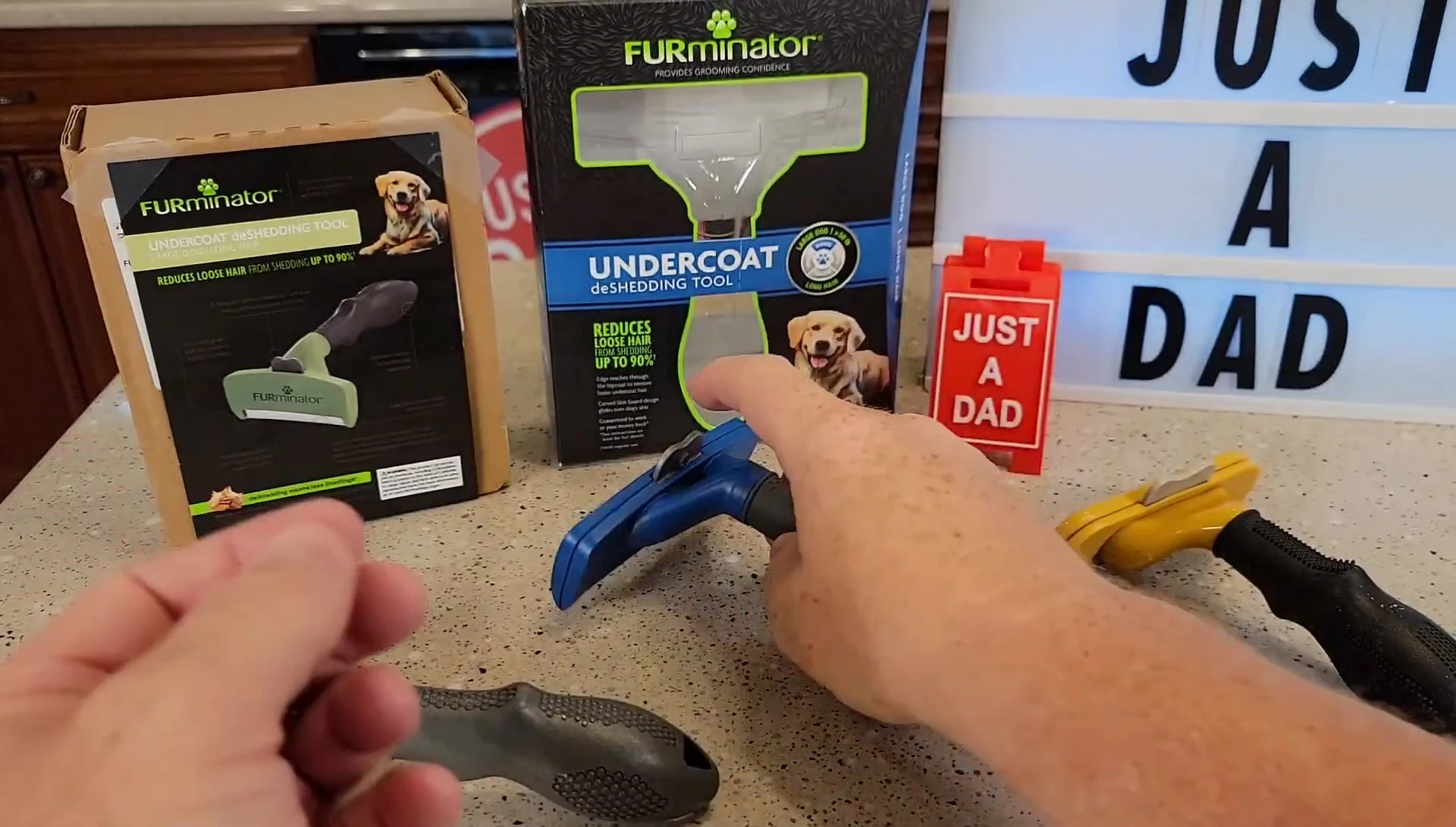 Demonstration of the locking mechanism on the blue FURminator tool