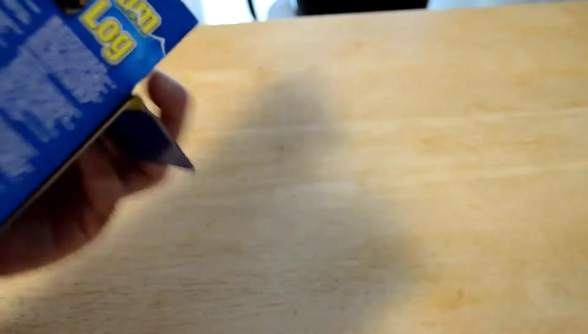 The reviewer showing the Zoo Med brand on the log packaging