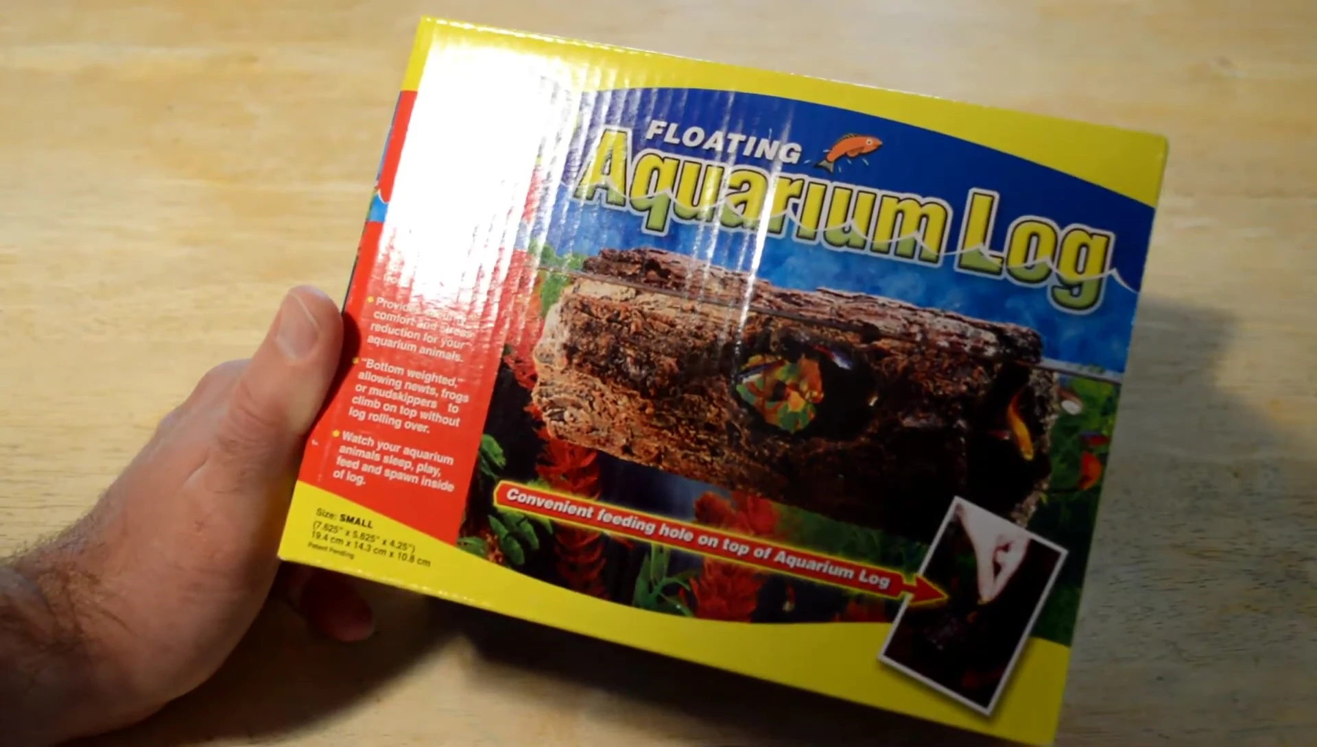 The reviewer is opening the package of the aquarium log.