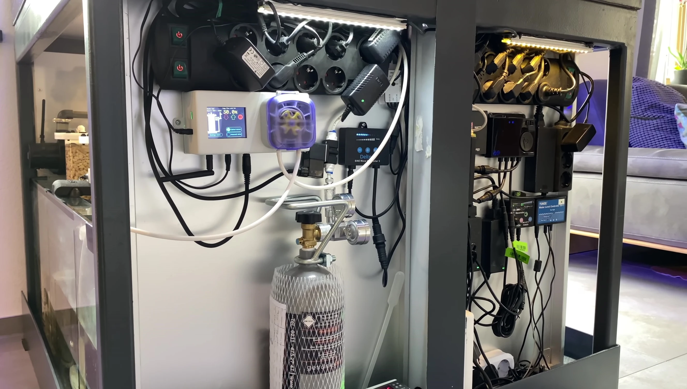 View of the aquarium cabinet showing the integrated equipment.