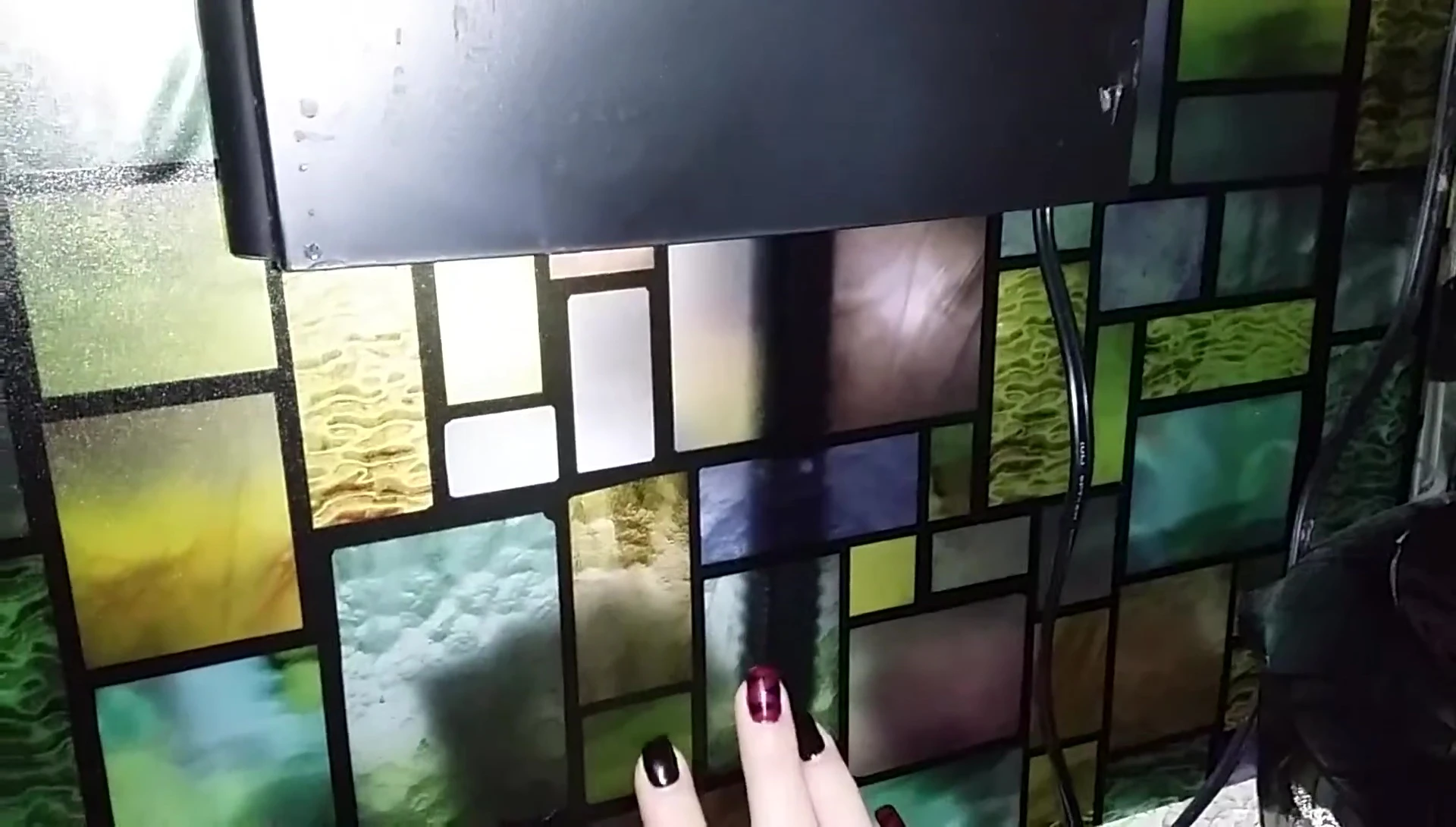 Close-up of the cling applied to the fish tank, showcasing the stained-glass look.