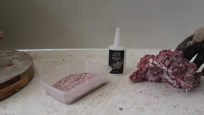 Choose Rock Placement: Select two rocks and determine how they will interlock to create a hanging structure. Find edges and grooves that fit together naturally.