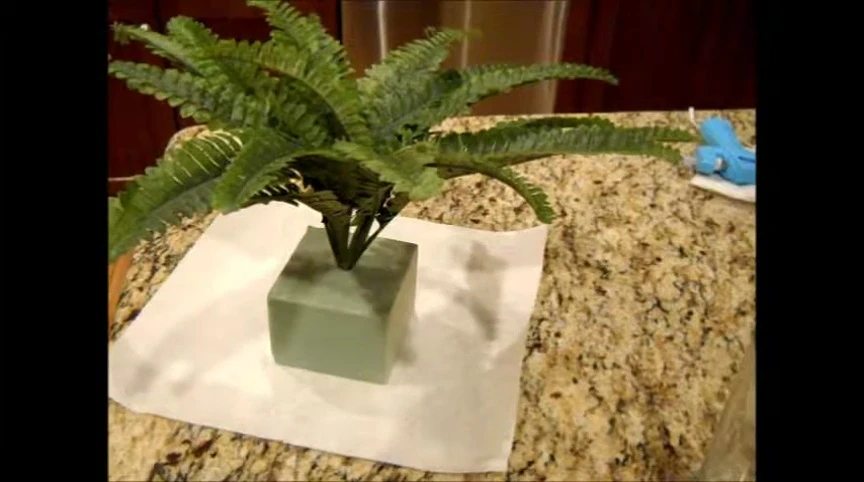 Screenshot showing the process of applying moss to the base.