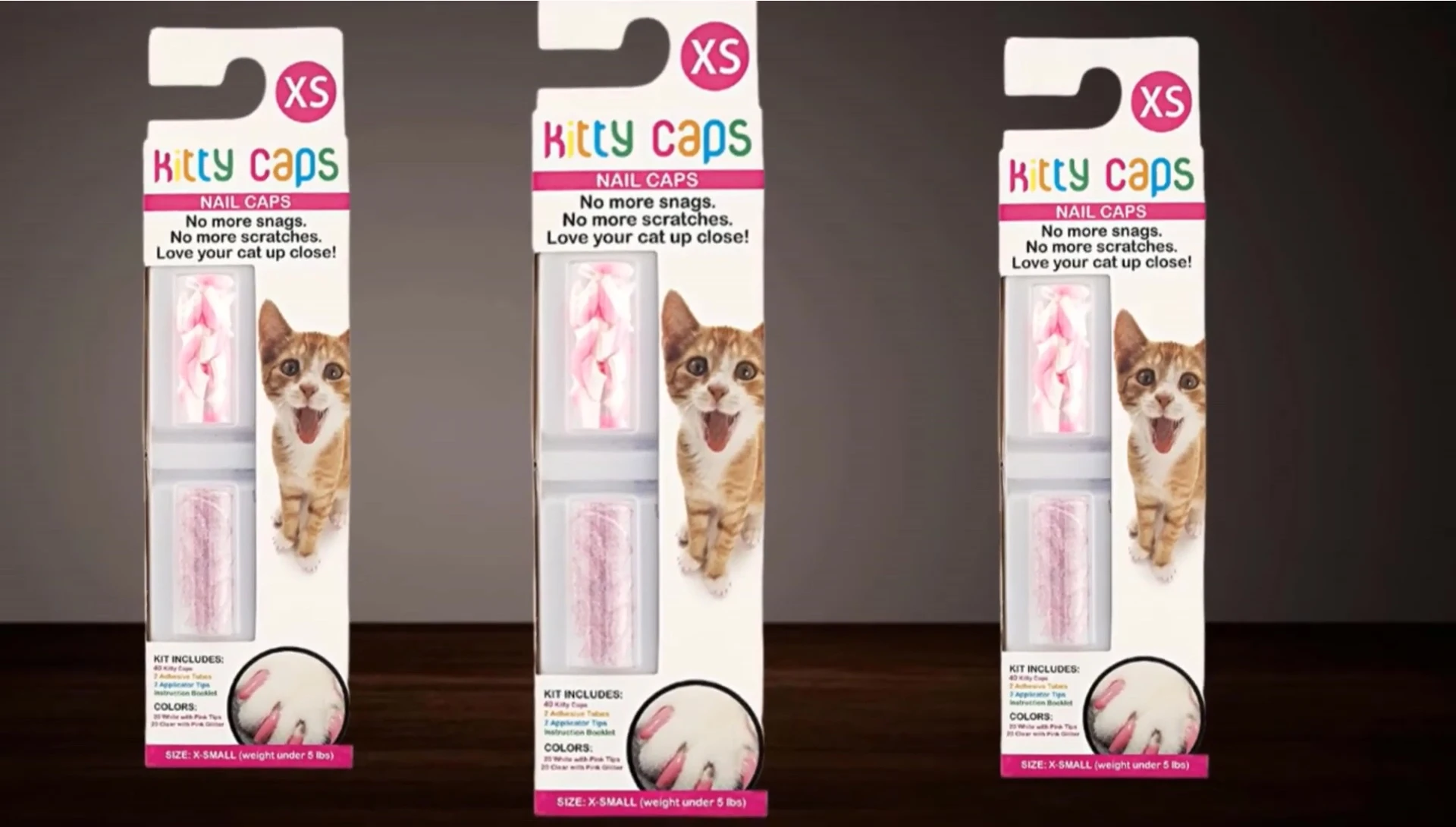 Cat displaying Kitty Caps nail caps