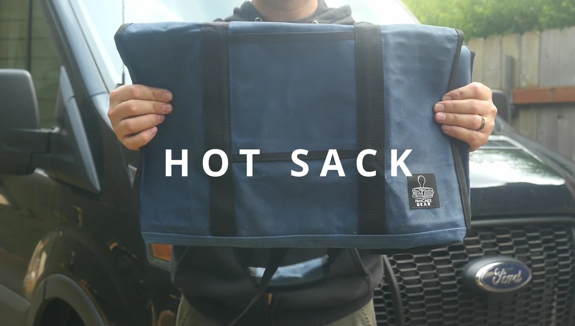 Logan Reynolds holding the Hot Sack bag.