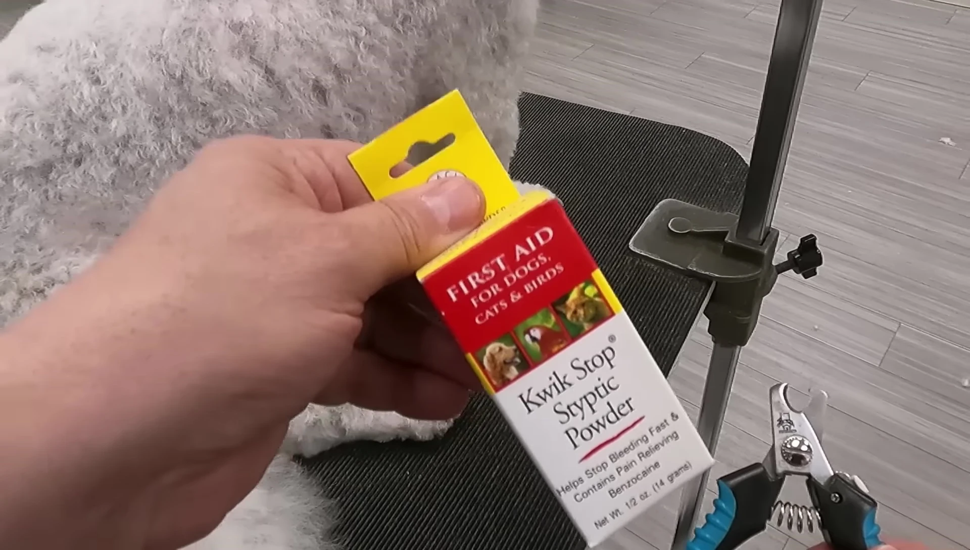 Styptic powder and nail clippers ready for use.