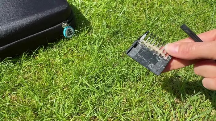 Remove comb attachment (if used) and brush away clipped hair from both sides of the blade.