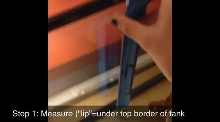 Measure your tank's dimensions. Measure the height from under the lip of the tank straight down to the silicone, and then measure the width from lip to lip.