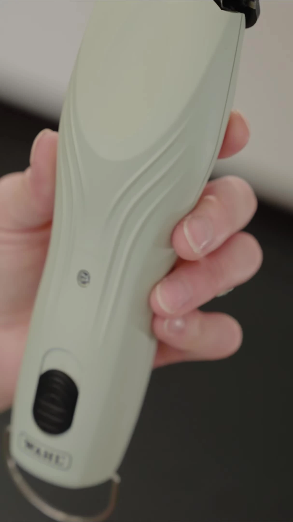 Close-up of the textured housing of the Wahl KMC+ clipper.