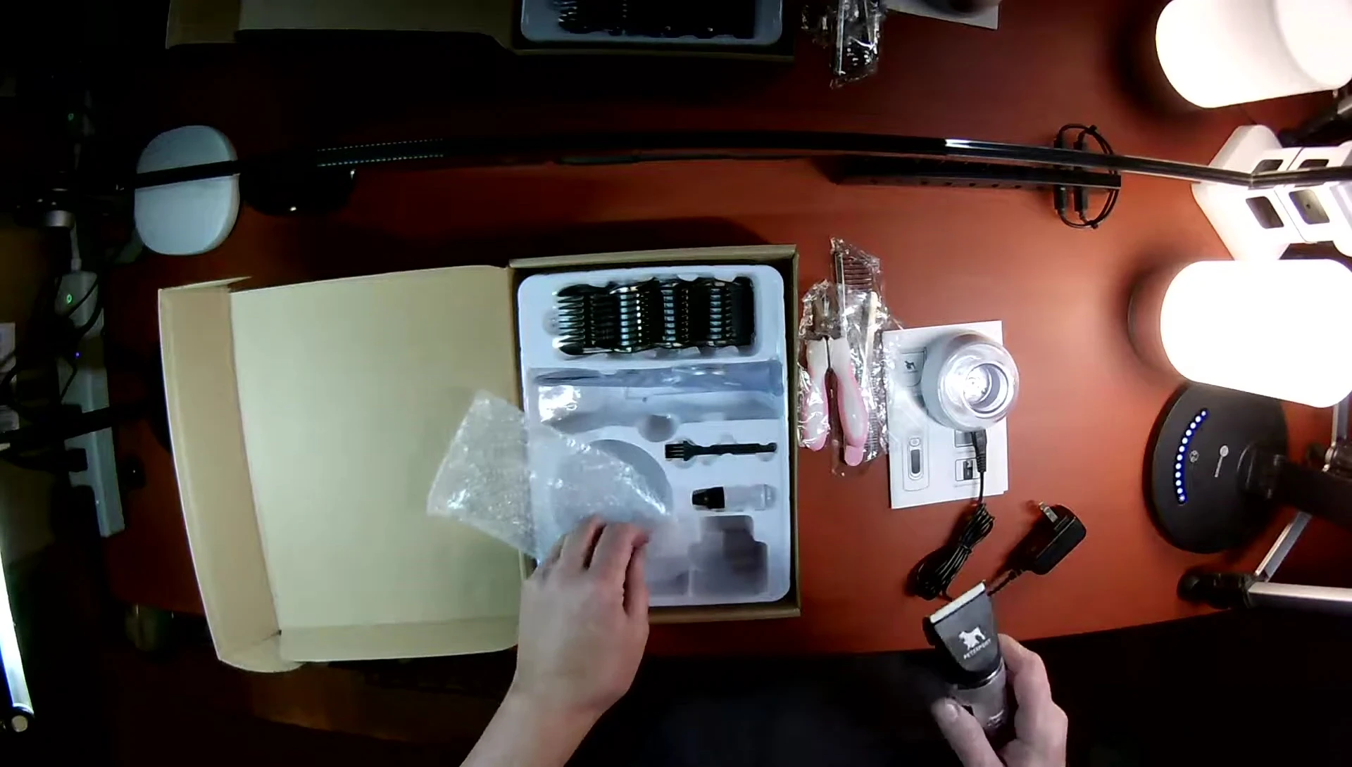 The oil and cleaning brush for the clippers.