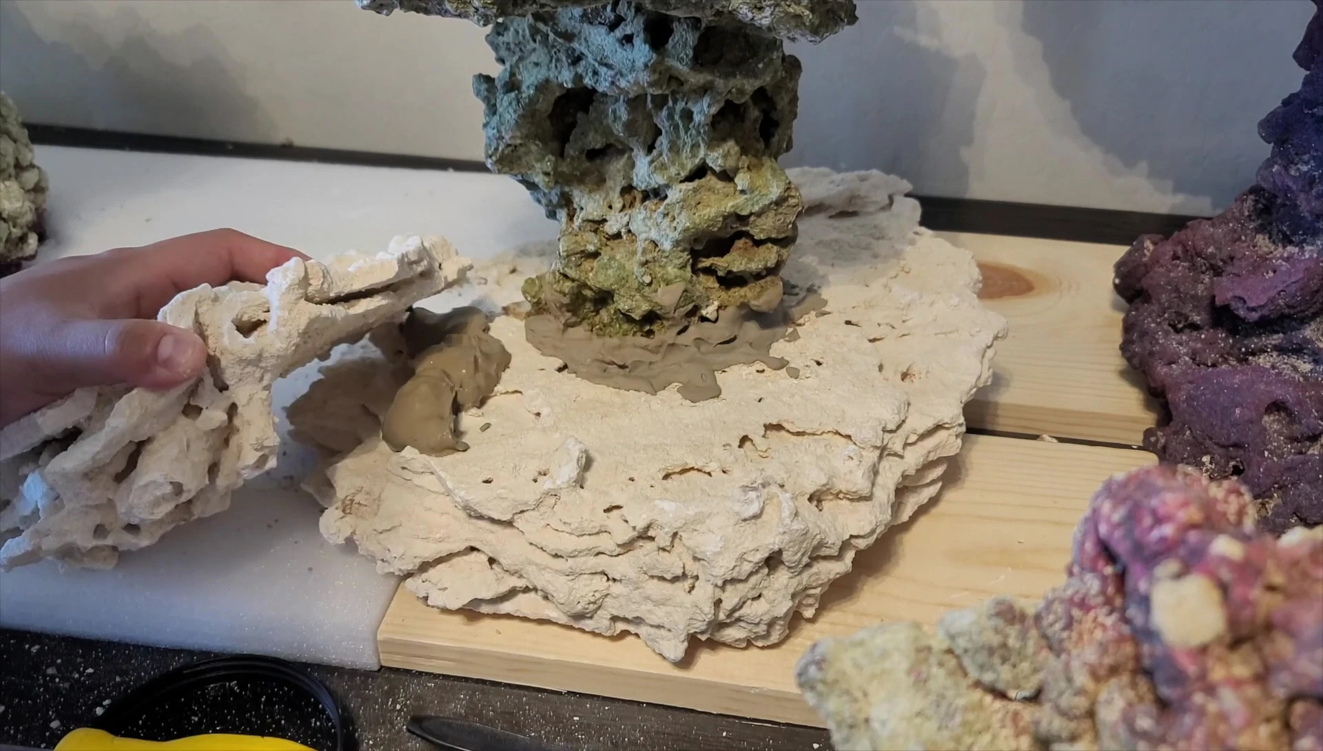 Applying the second layer of watery cement.
