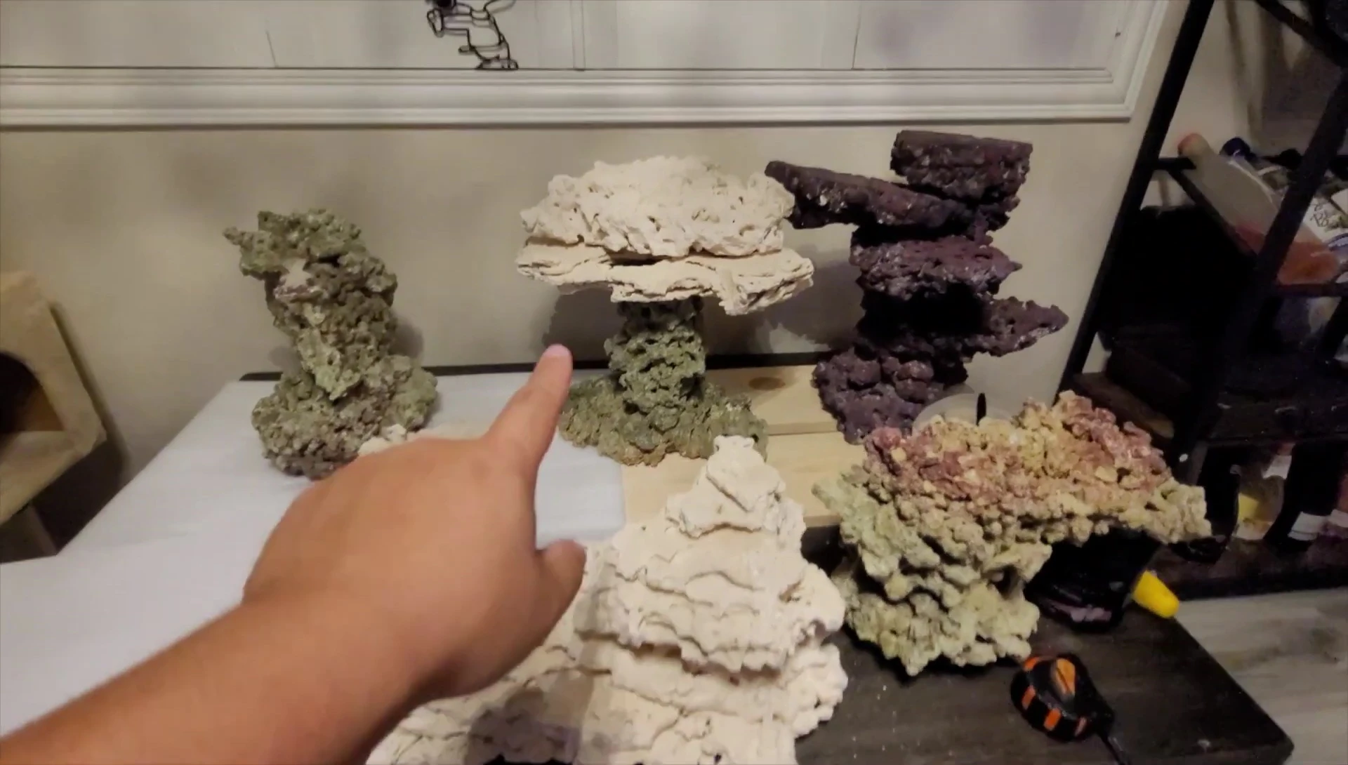 Close-up shot of the SPS corals positioned on top of the rock structures.