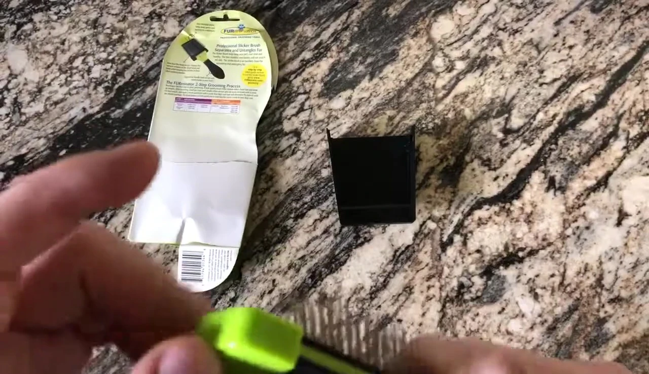 The reviewer demonstrating the flexible head of the brush.