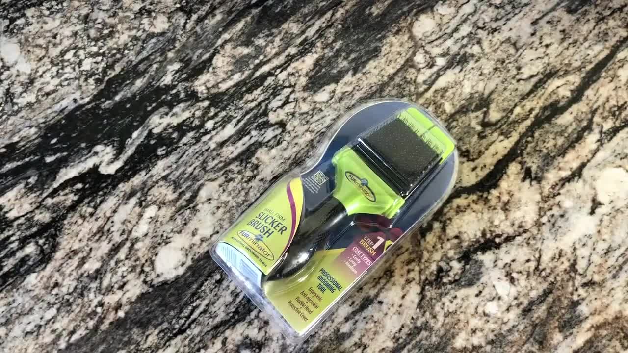 Close-up of the Furminator Slicker Brush packaging.