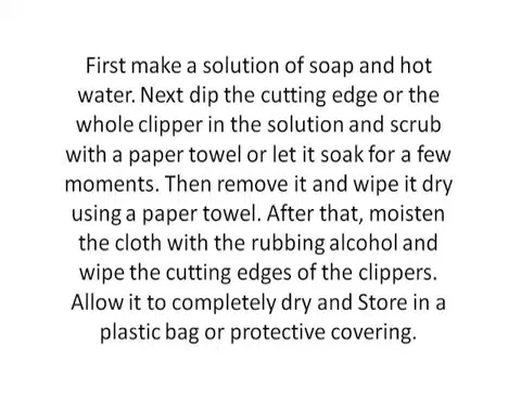 Clipper being wiped with rubbing alcohol.