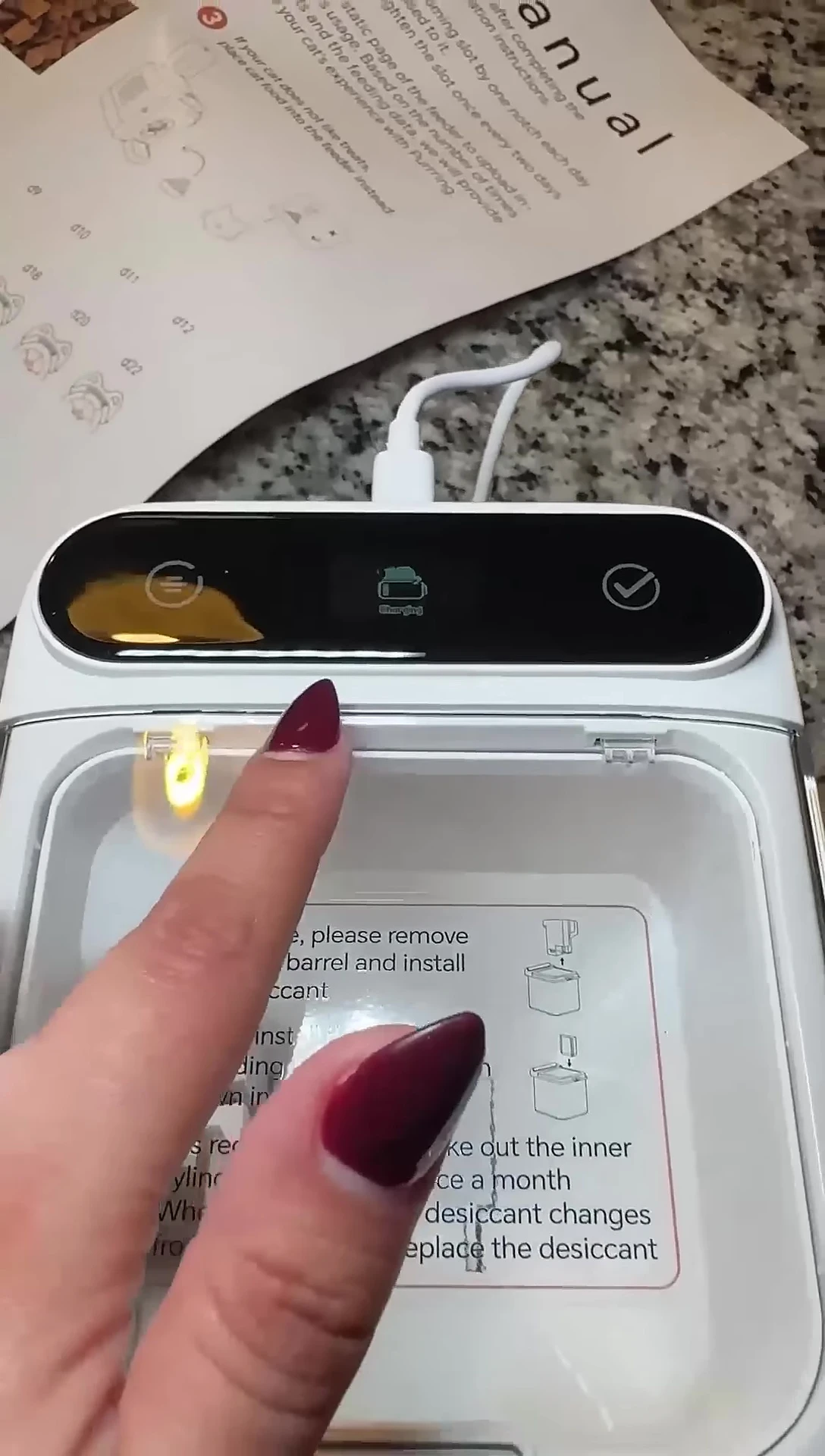 The reviewer's cat entering the AutoComb.