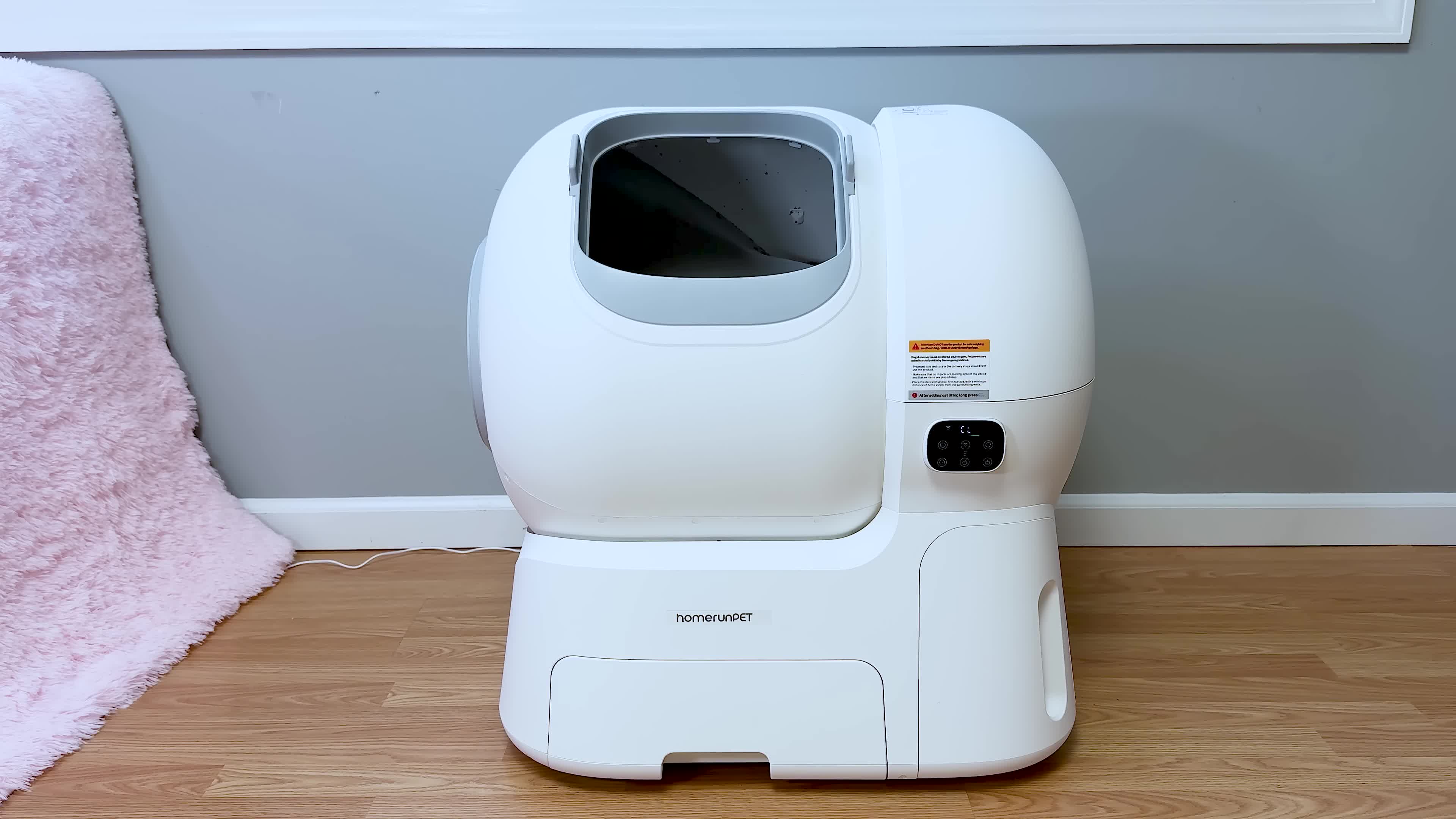 Close-up of the litter box highlighting its large capacity.