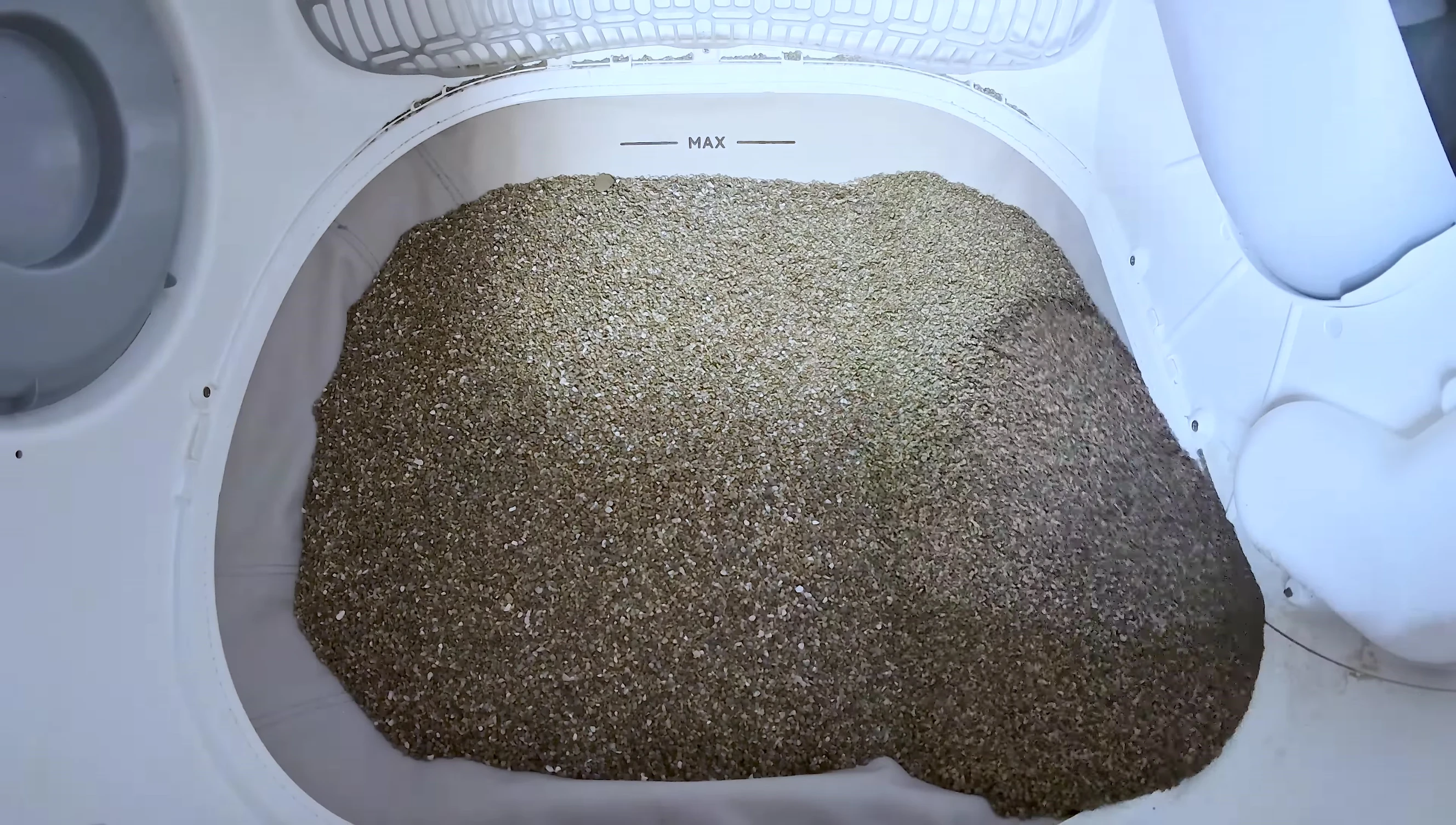 Close-up highlighting the deep litter bed.