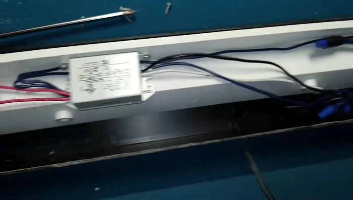 Remove the old ballast. Note the wiring connections before disconnecting.