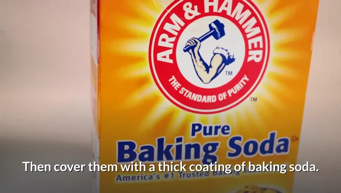 Add either dishwashing liquid or hydrogen peroxide solution to the baking soda, creating a paste. Let it air dry, then vacuum.