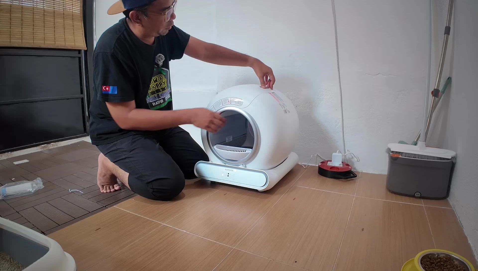 Demonstration of the waste tray removal for cleaning.