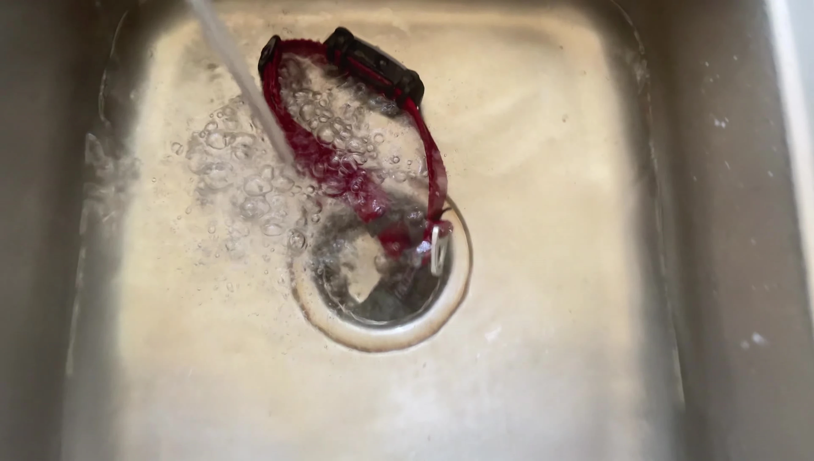 The tracker being submerged in water