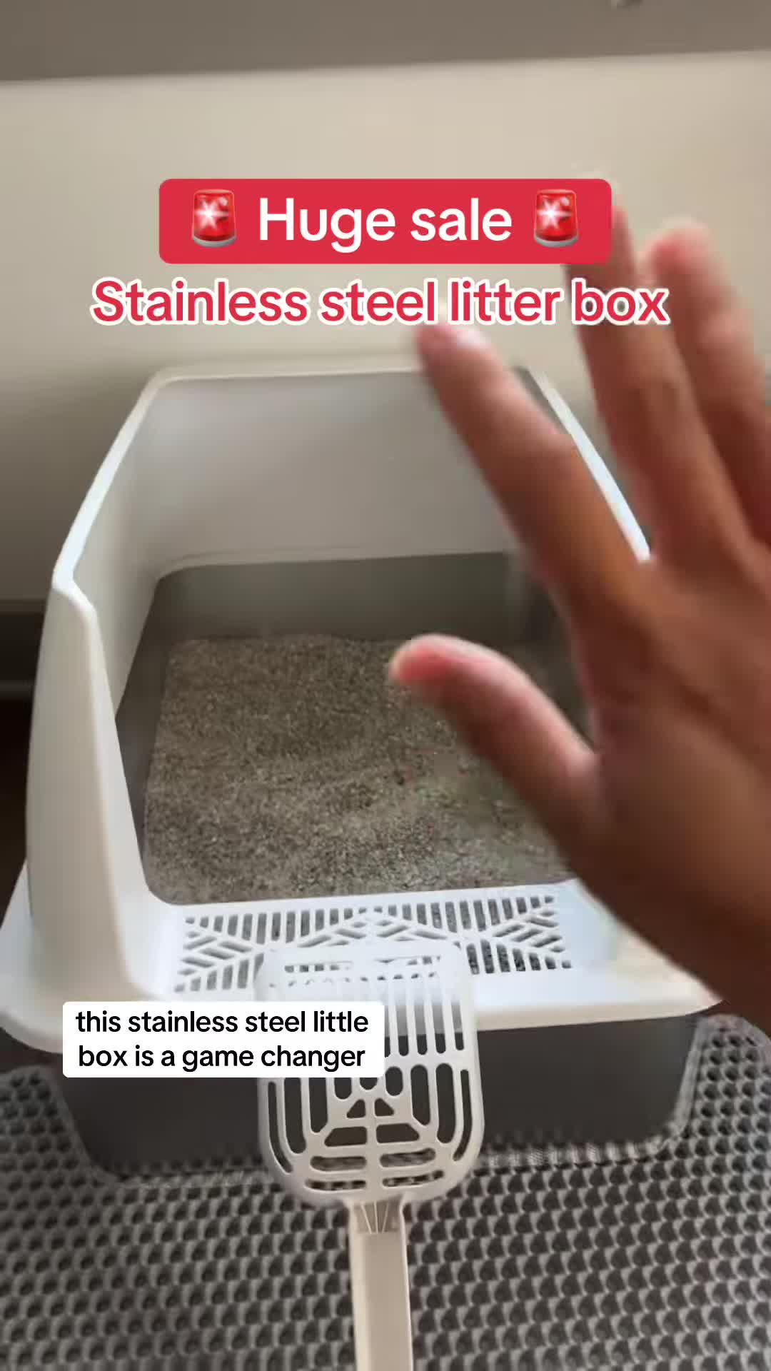 Comparison shot of stainless steel vs. plastic litter box, highlighting easy cleaning