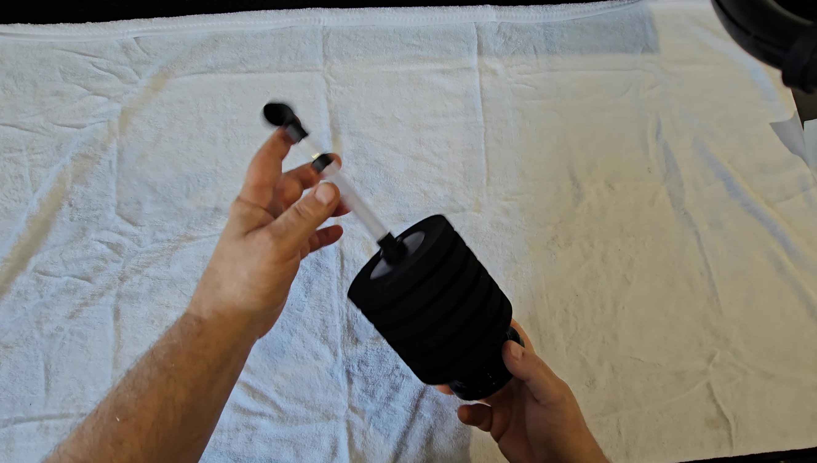Presenter holding up the filter, emphasizing its high quality.