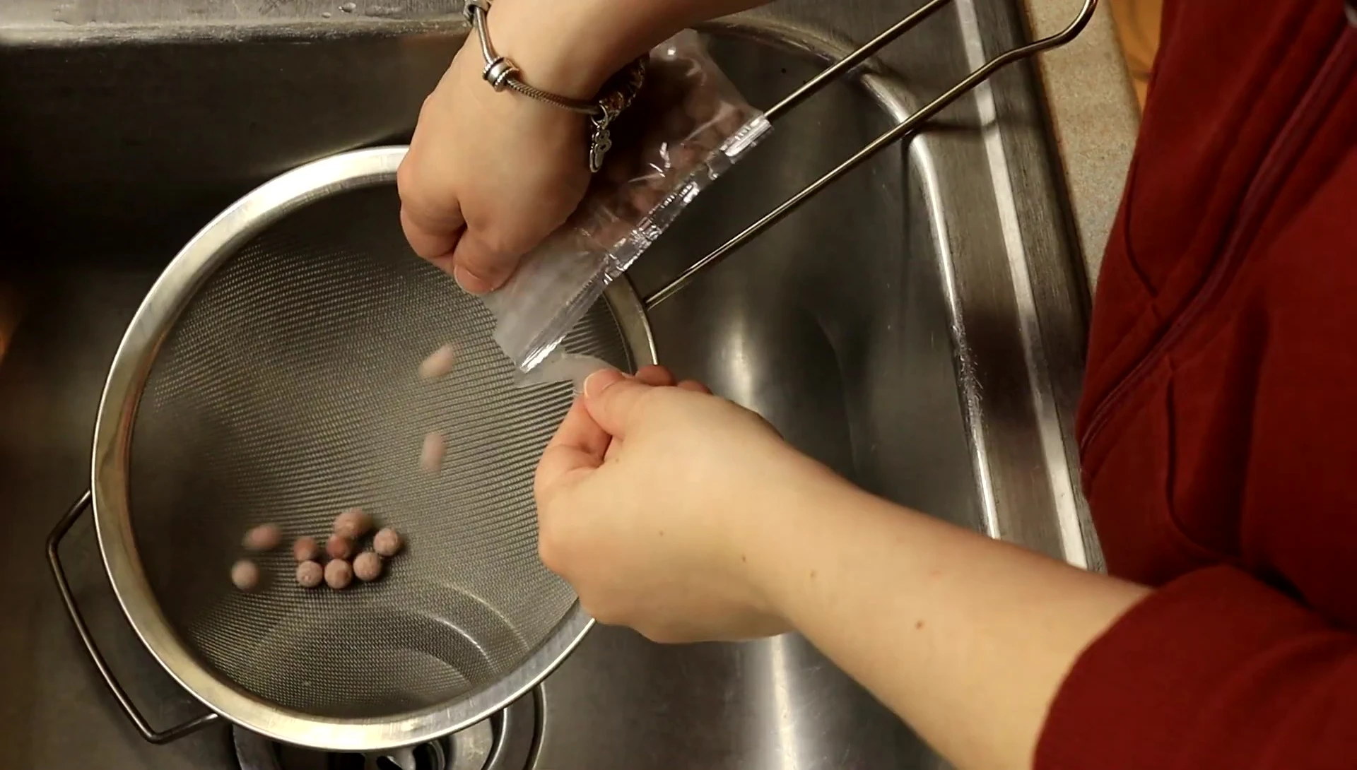 Cleaning the ceramic balls using a strainer